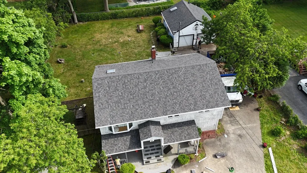 Slide of QB Roofing Solutions