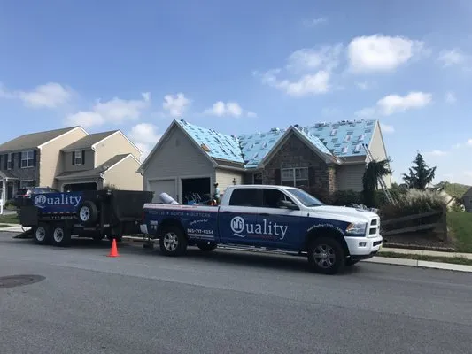 Quality Home Exteriors Logo
