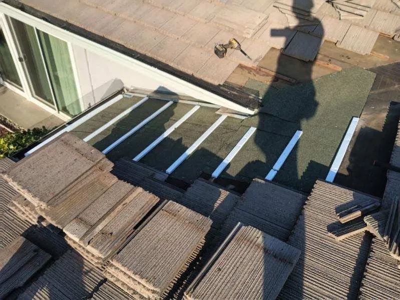 Slide of Quinn Bro's Roofing