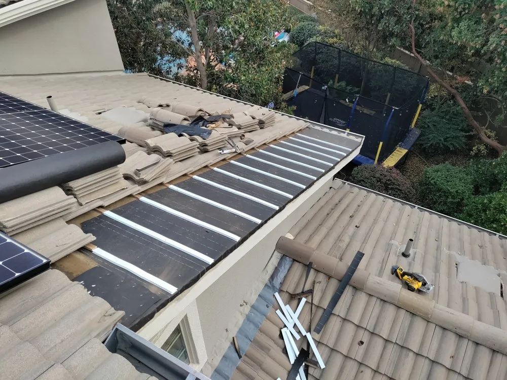 Slide of Quinn Bro's Roofing