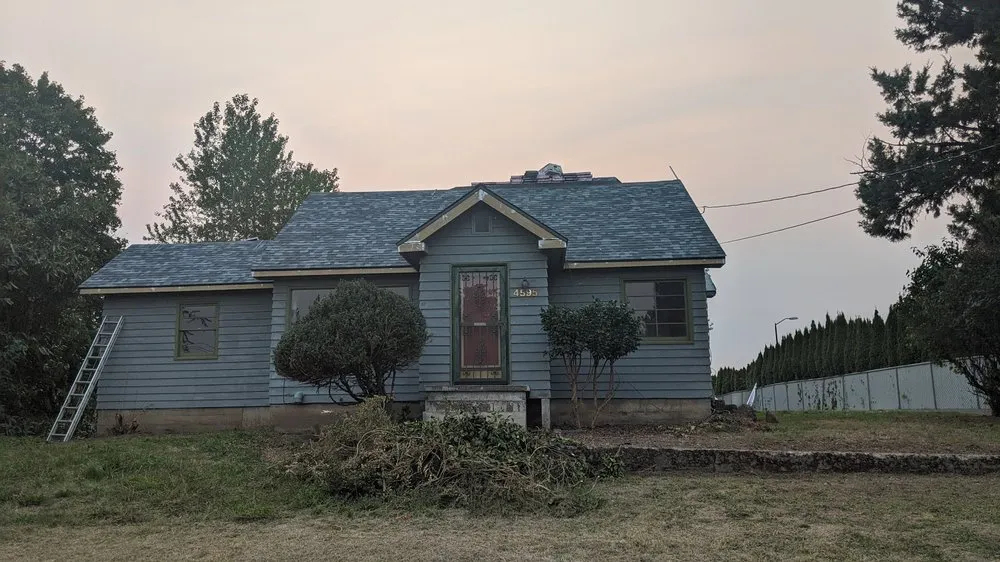 Slide of Quintana Roofing