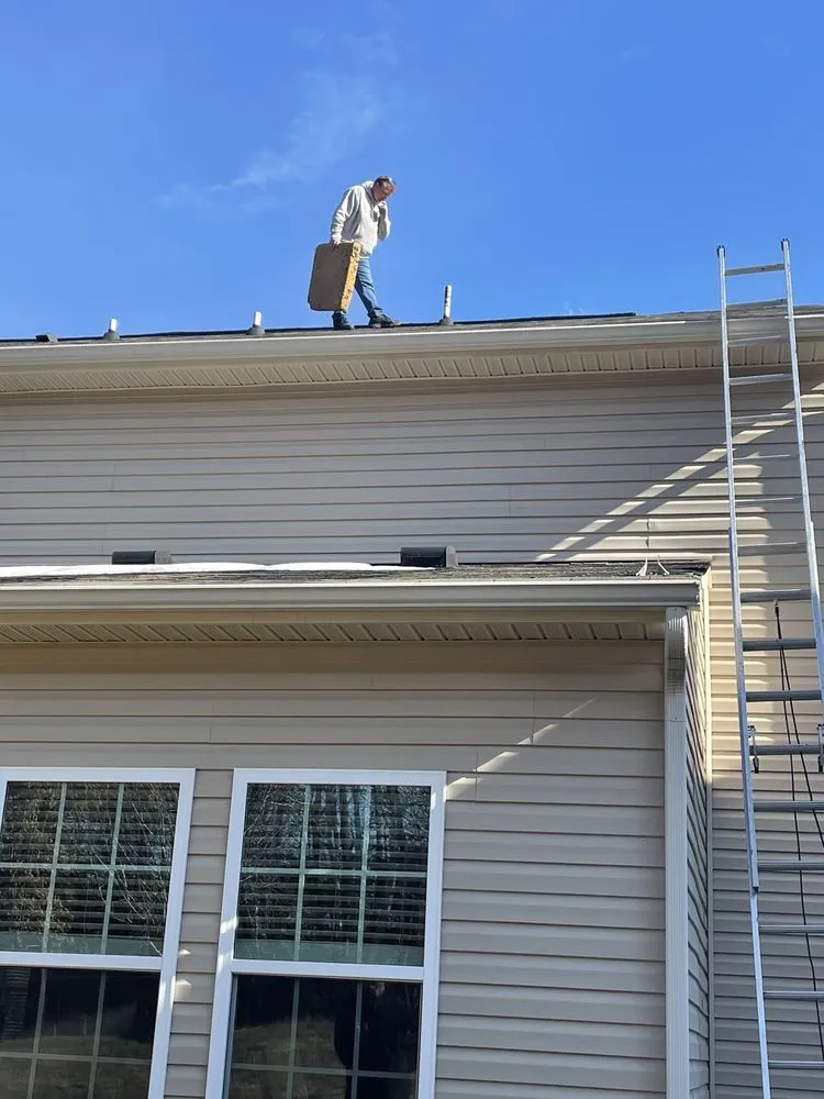 Slide of Race City Roofing