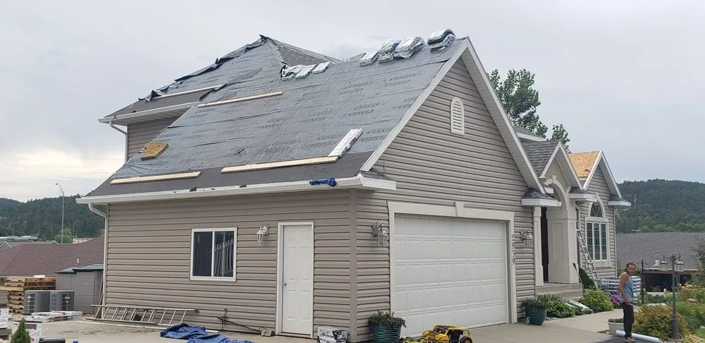 Slide of RainTite Roofing & Construction