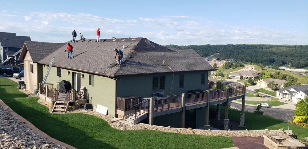 Slide of RainTite Roofing & Construction