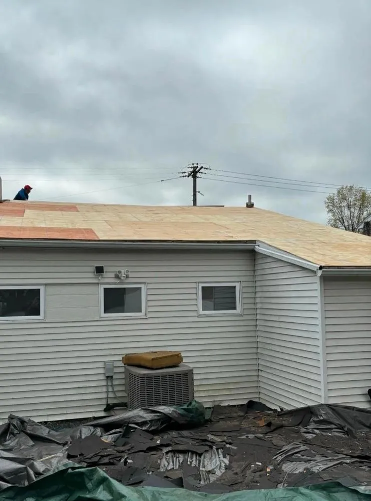 Slide of Randy's Roofing Construction