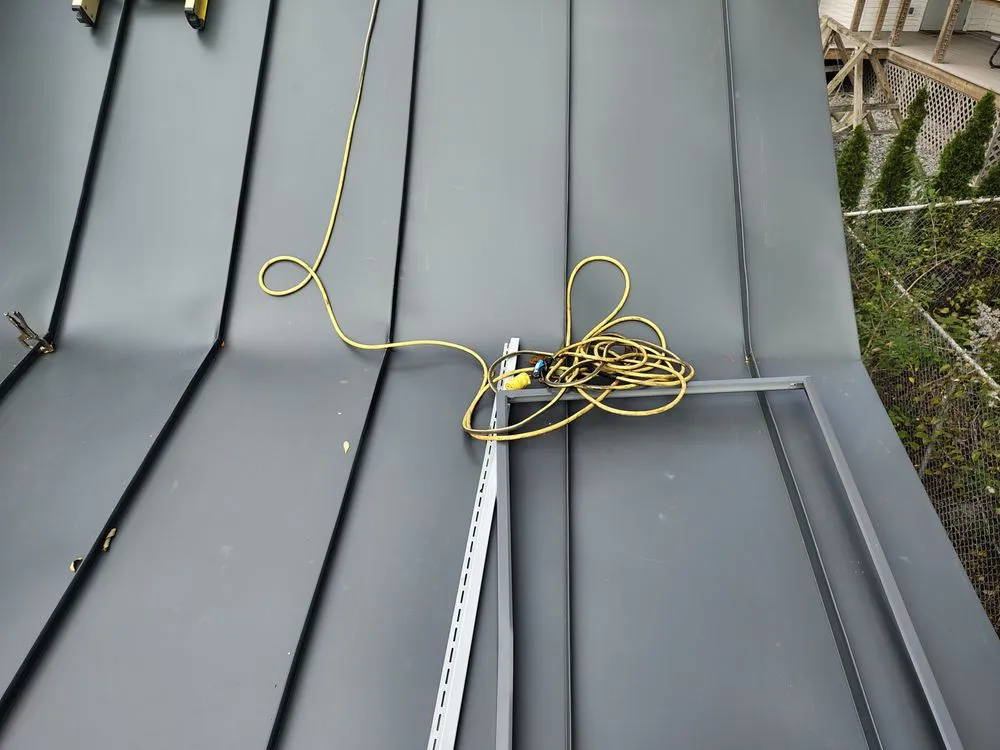 Slide of Raymonds Roofing & Construction