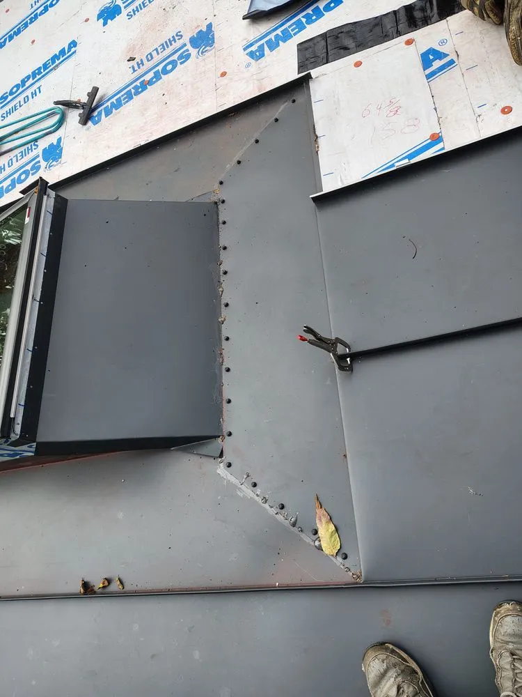 Slide of Raymonds Roofing & Construction