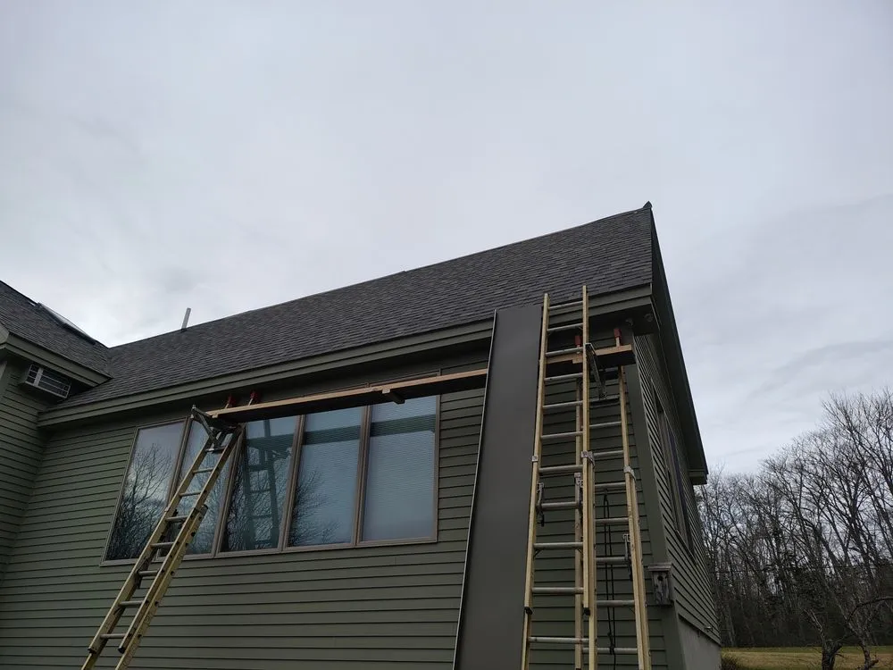 Slide of Raymonds Roofing & Construction