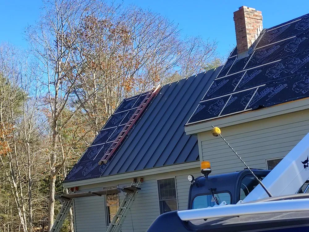 Slide of Raymonds Roofing & Construction