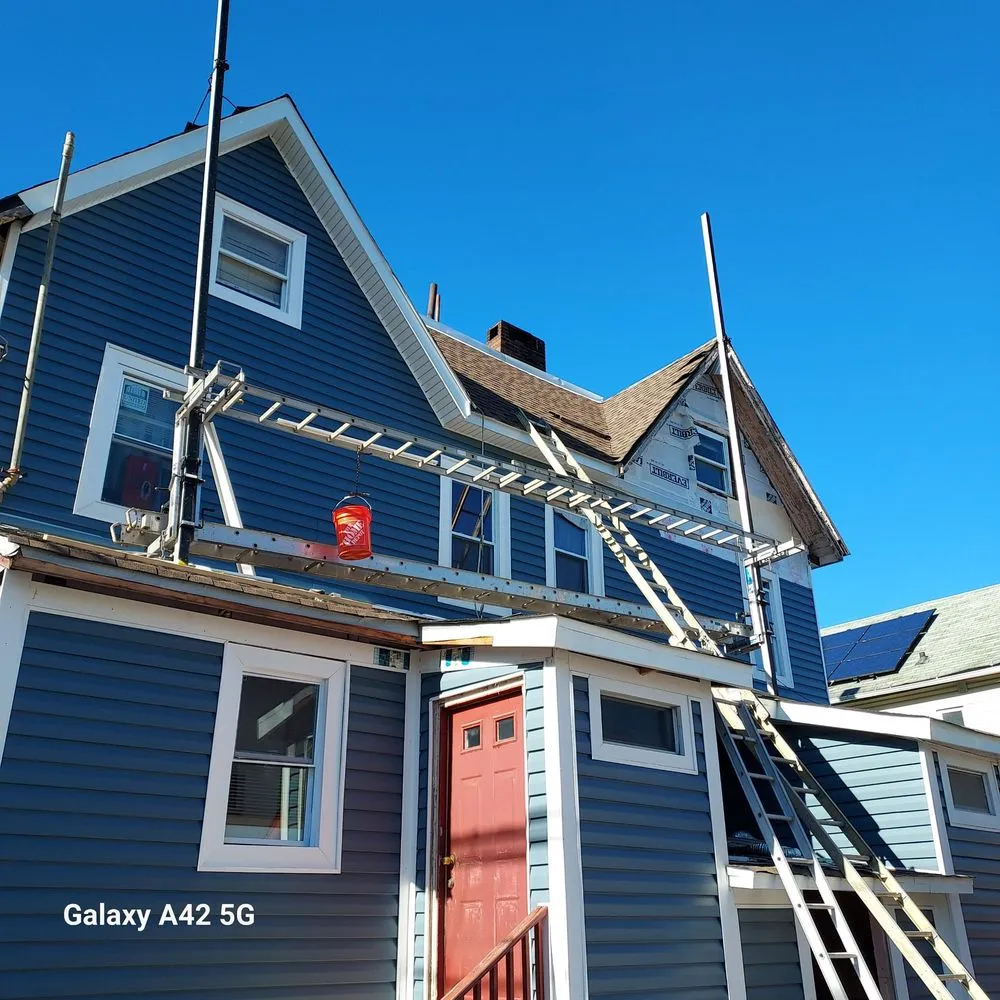 Slide of RC Roofing and Siding