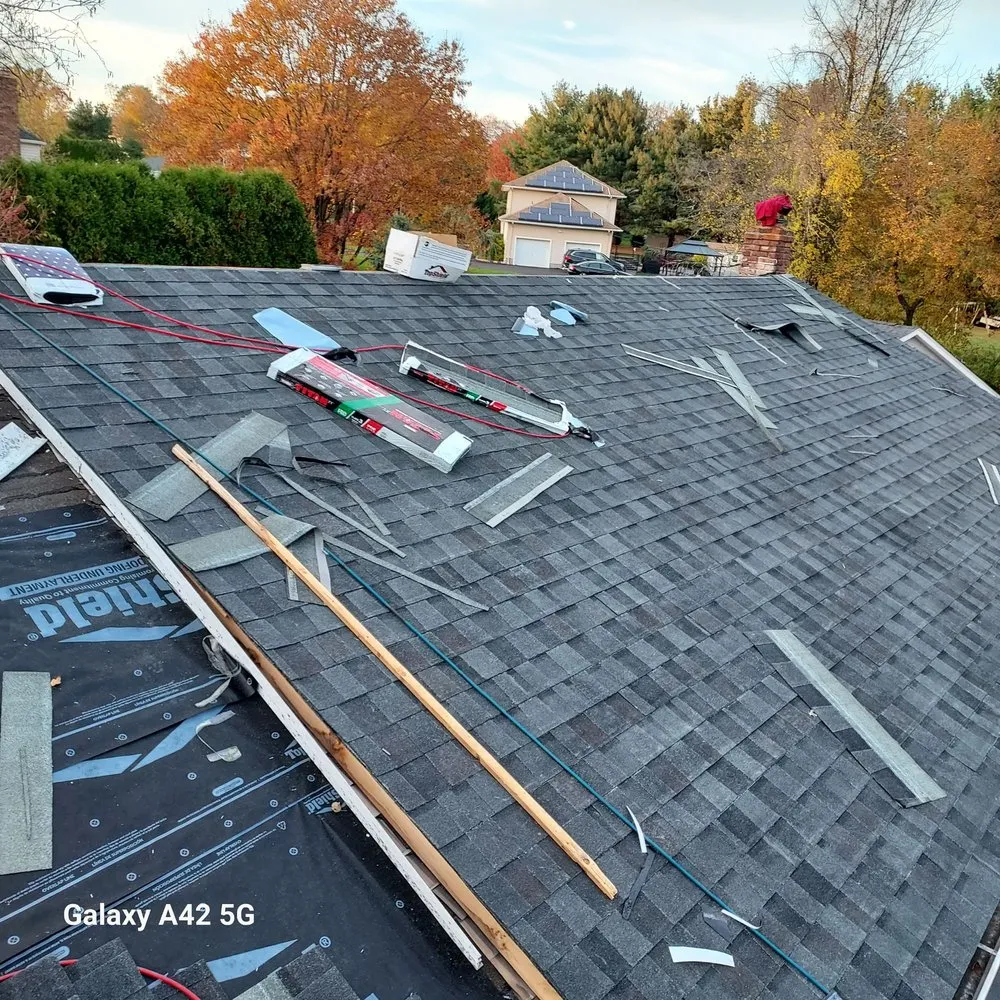 Slide of RC Roofing and Siding