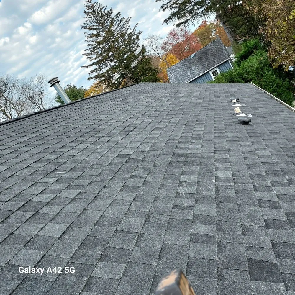 Slide of RC Roofing and Siding