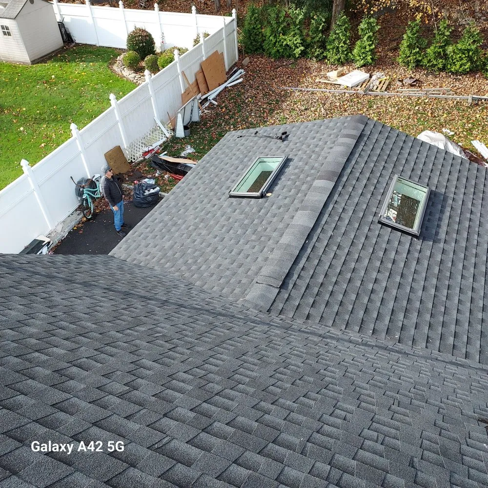 Slide of RC Roofing and Siding