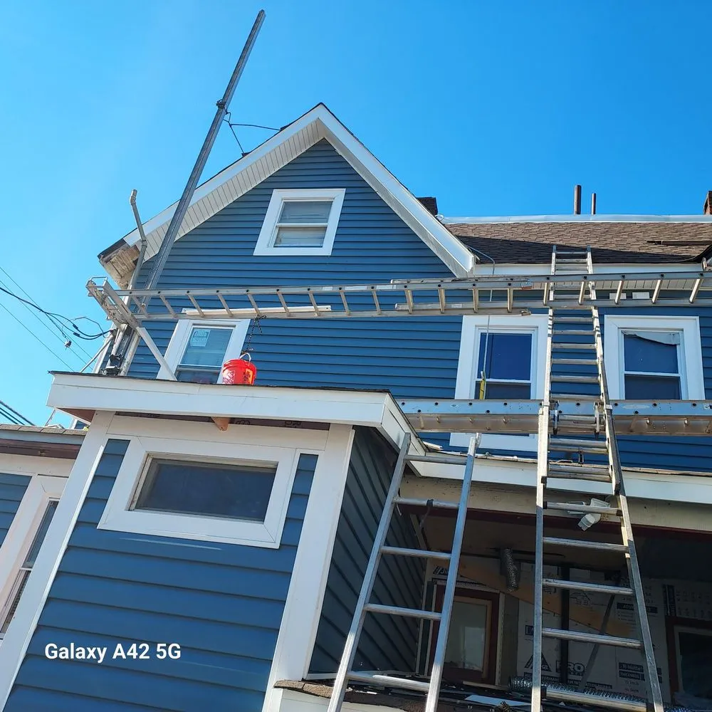 Slide of RC Roofing and Siding