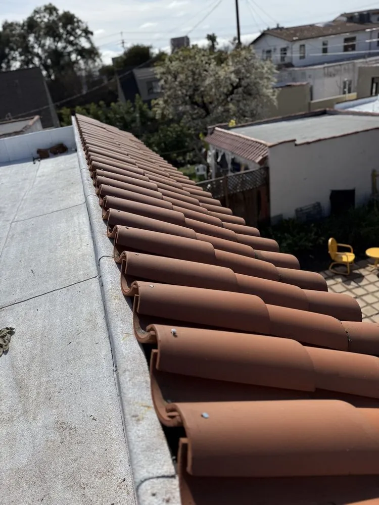 Slide of Real Bros Roofing