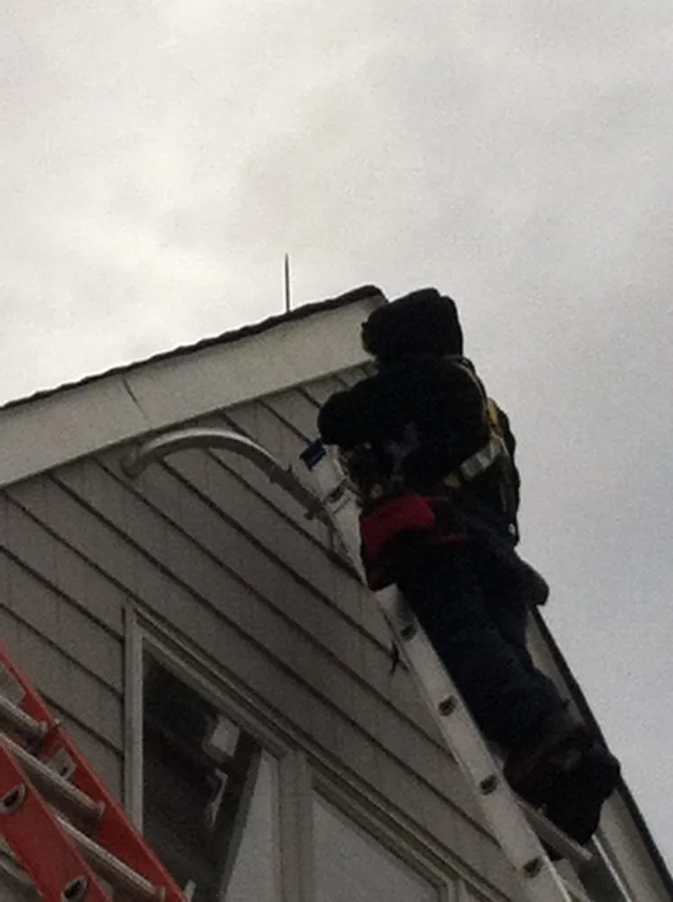 Slide of Real Roofers