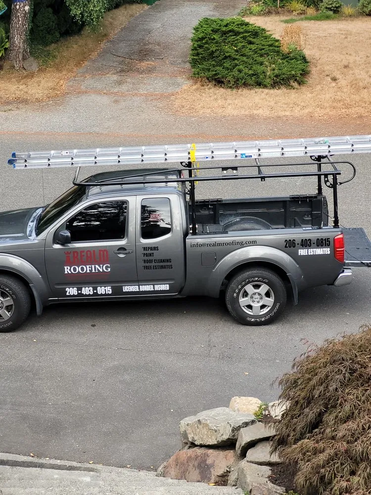 Slide of Realm Roofing