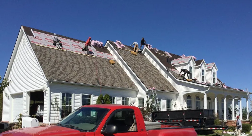 Slide of Red Hog Roofing
