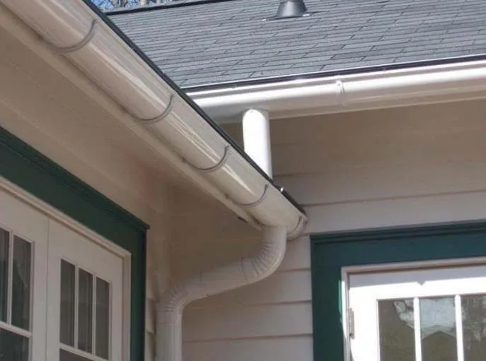 Slide of Red Roofing and Gutters