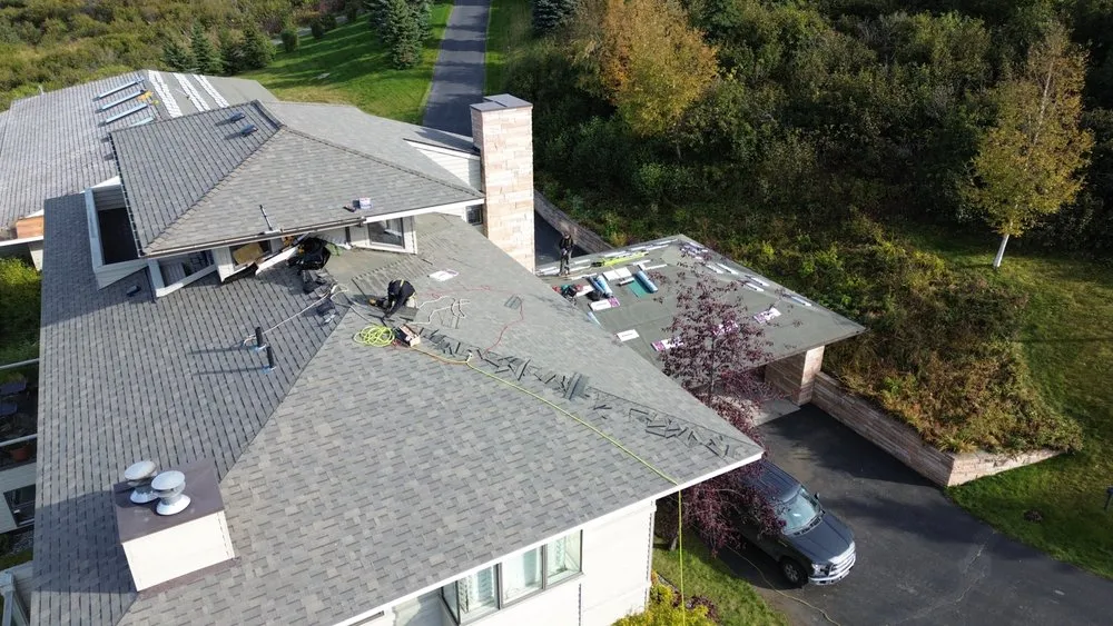 Slide of Reds Roofing & Renovations