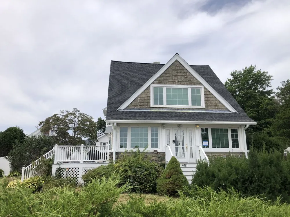 Slide of REI Roofing