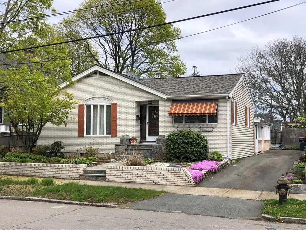 Slide of REI Roofing