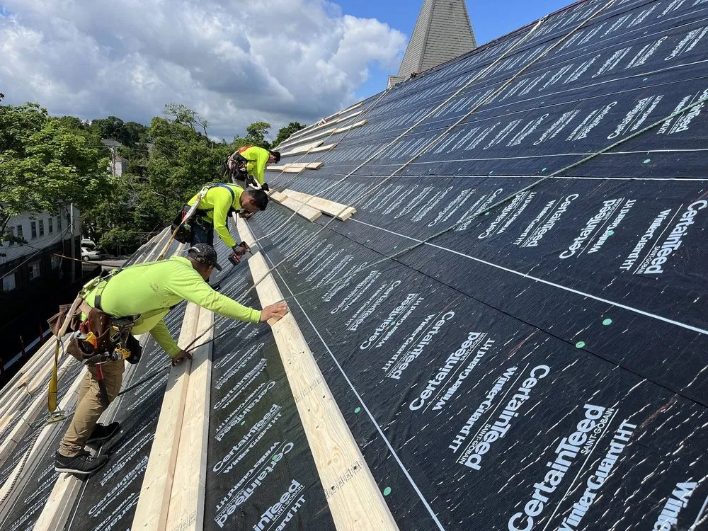 Slide of REI Roofing