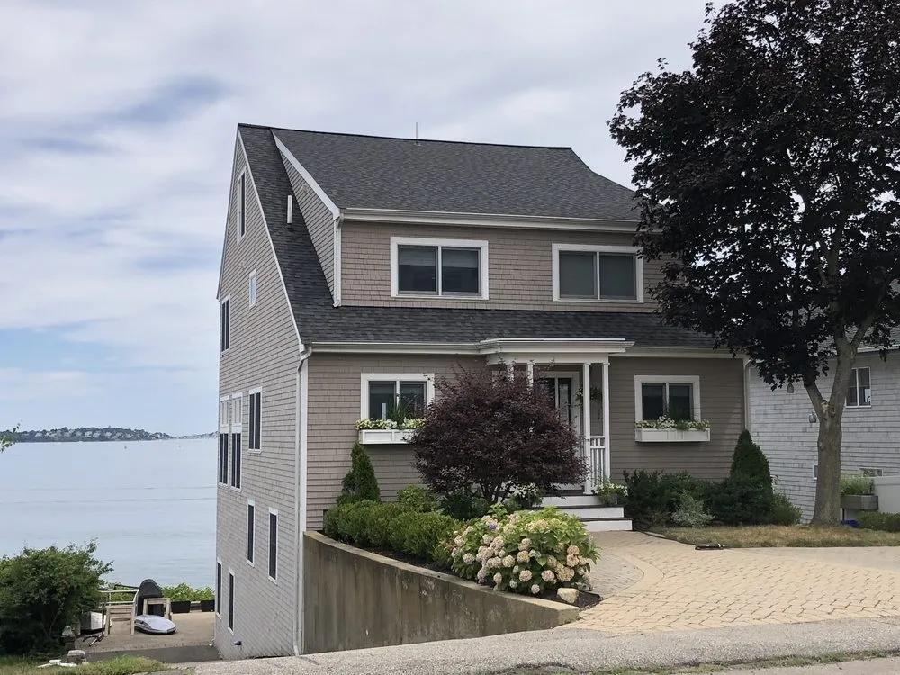 Slide of REI Roofing