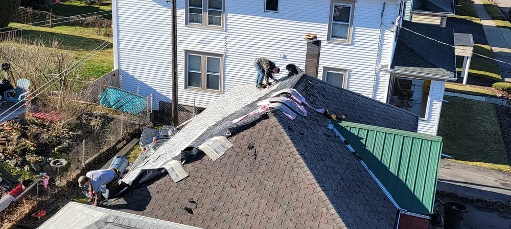 Slide of Reliance Roofing