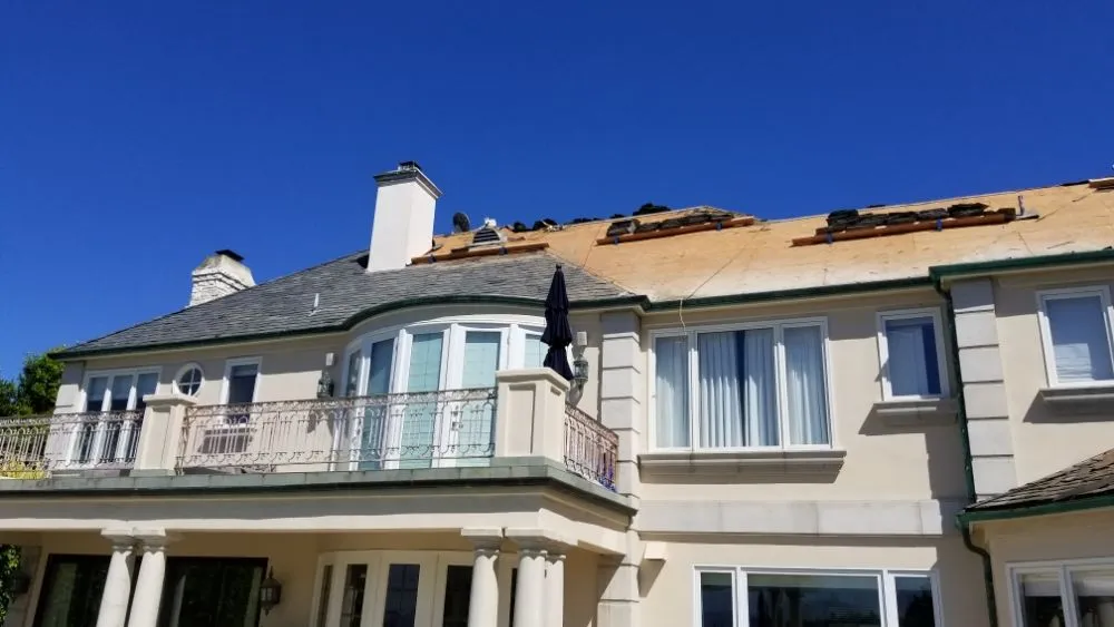 Slide of Rex Roofing