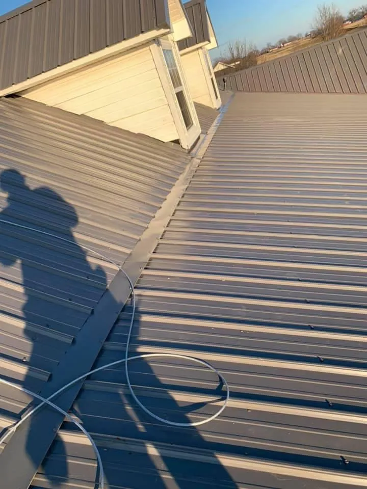 Professional storm damage roof repair in Okay, OK by Reyes Roofing