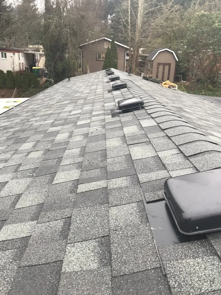 Slide of Reyes Roofing Pros