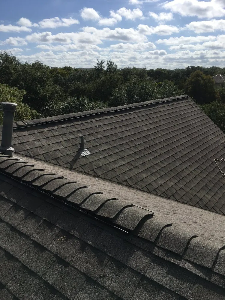 Slide of Rey's roofing and contractors