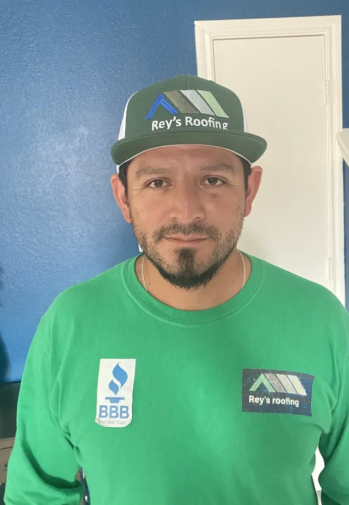 Slide of Rey's roofing and contractors