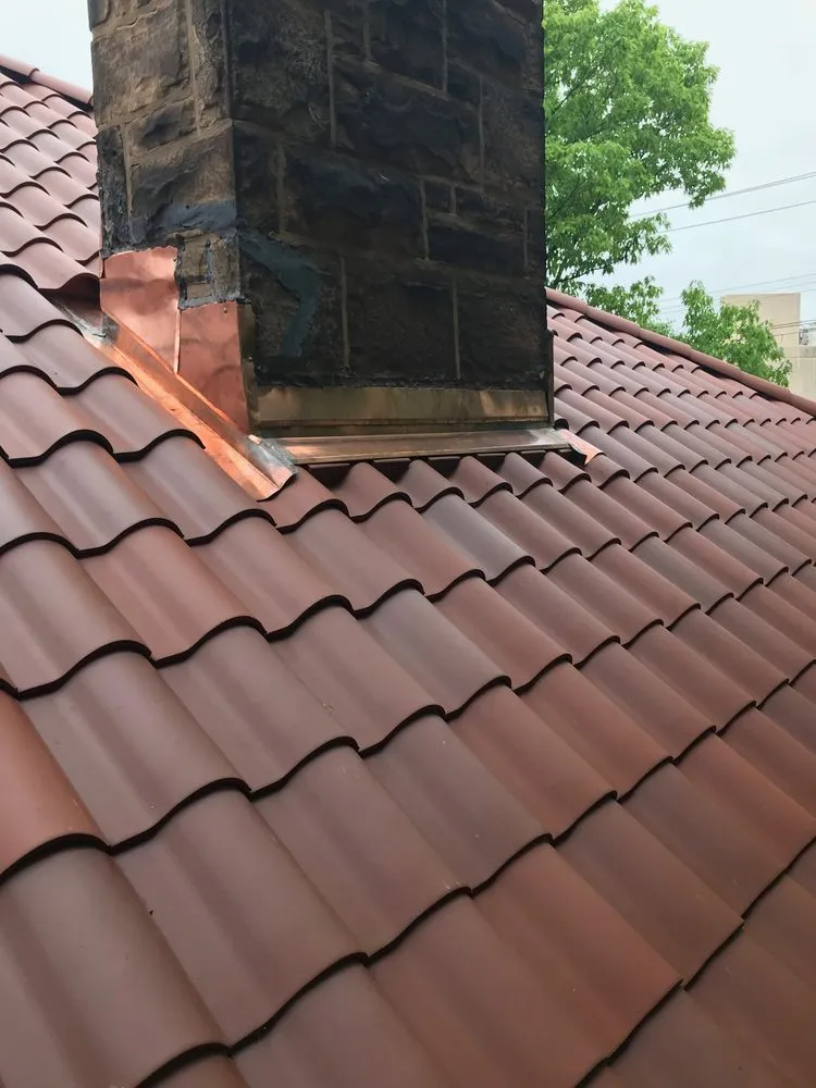 Slide of RickJohn Roofing