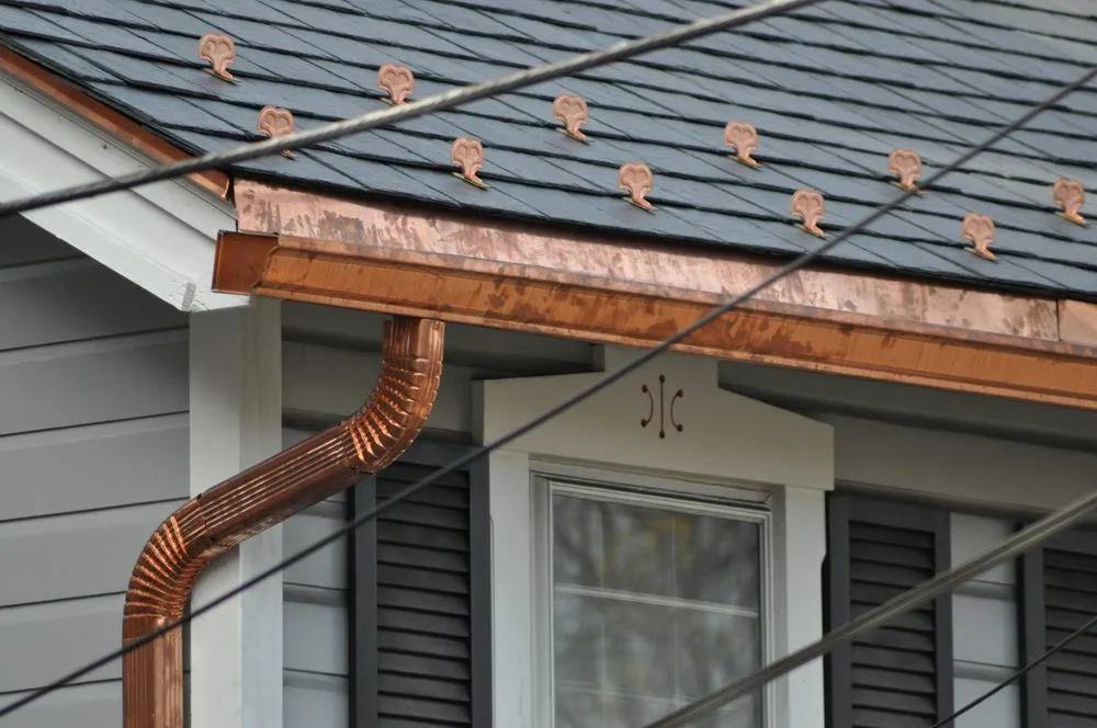 Slide of RickJohn Roofing