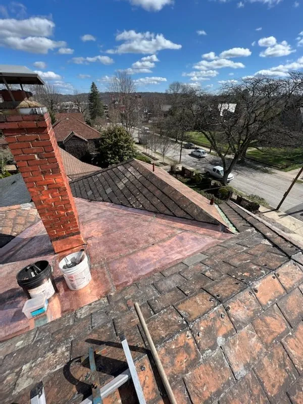 Slide of RickJohn Roofing