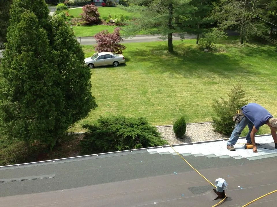 Slide of Rick's Main Roofing Ltd