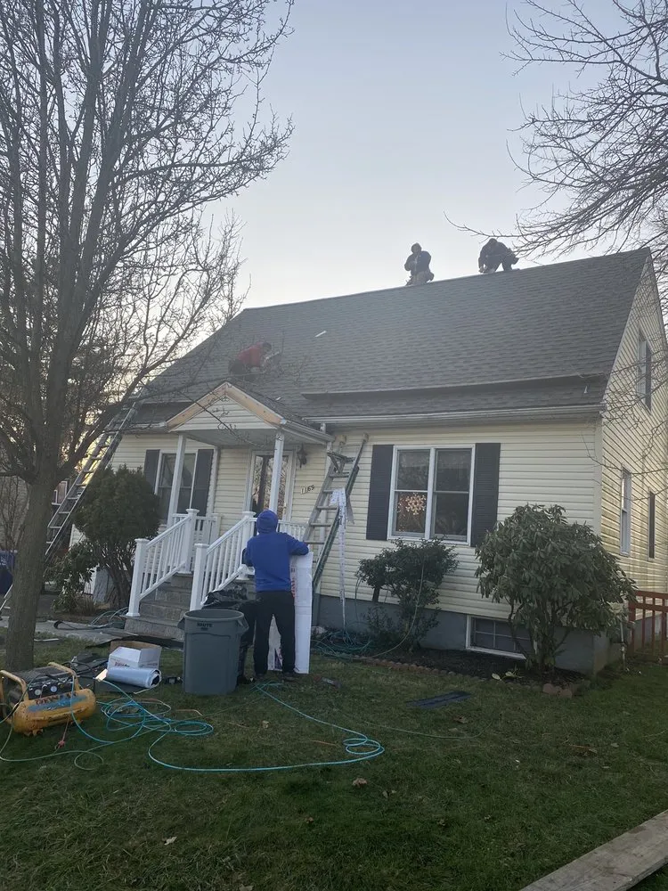 Slide of Rick's Main Roofing Ltd