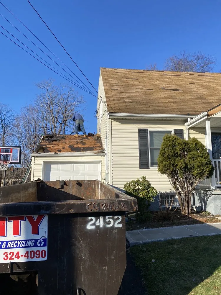 Slide of Rick's Main Roofing Ltd