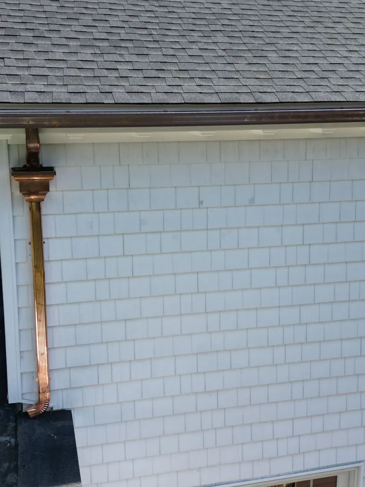 Slide of Rick's Main Roofing Ltd