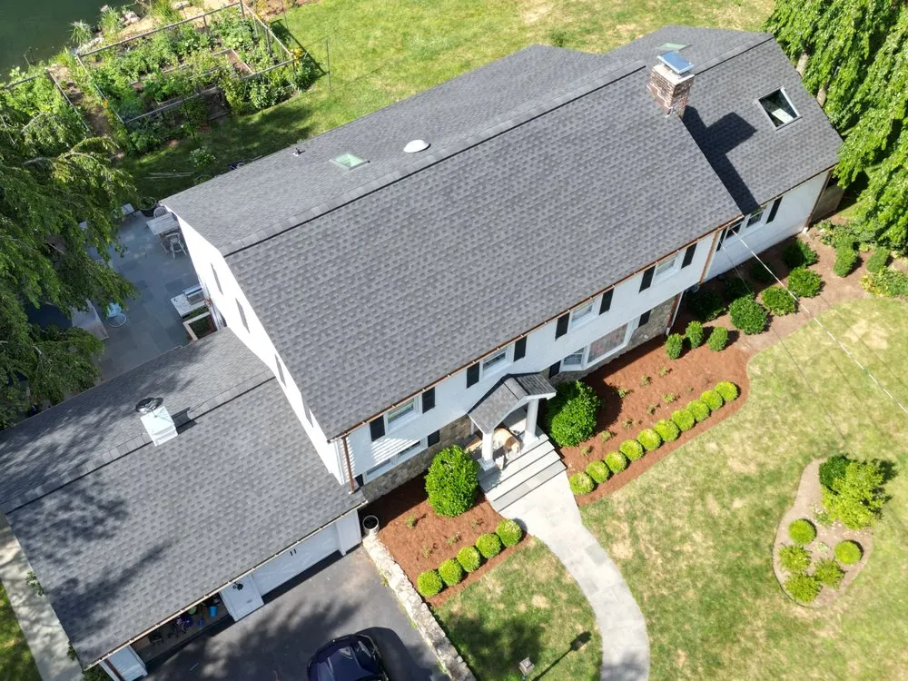 Slide of Rick's Main Roofing Ltd