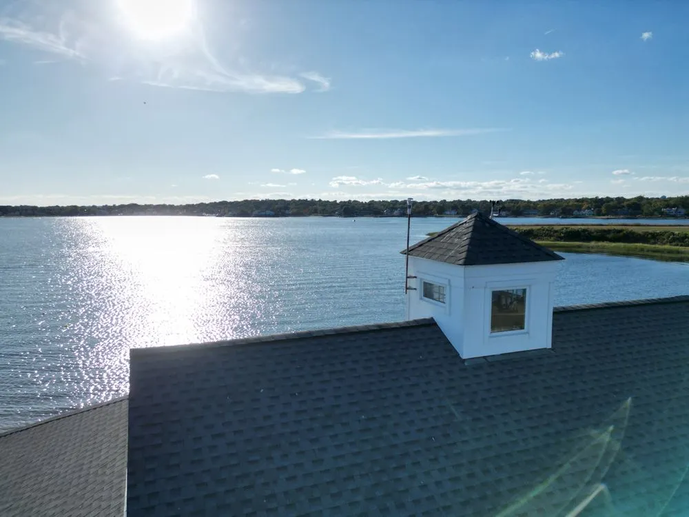 Slide of Rick's Main Roofing Ltd