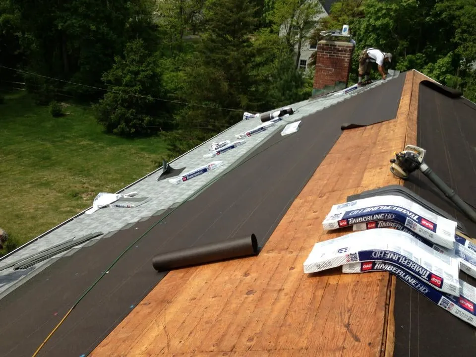 Slide of Rick's Main Roofing Ltd