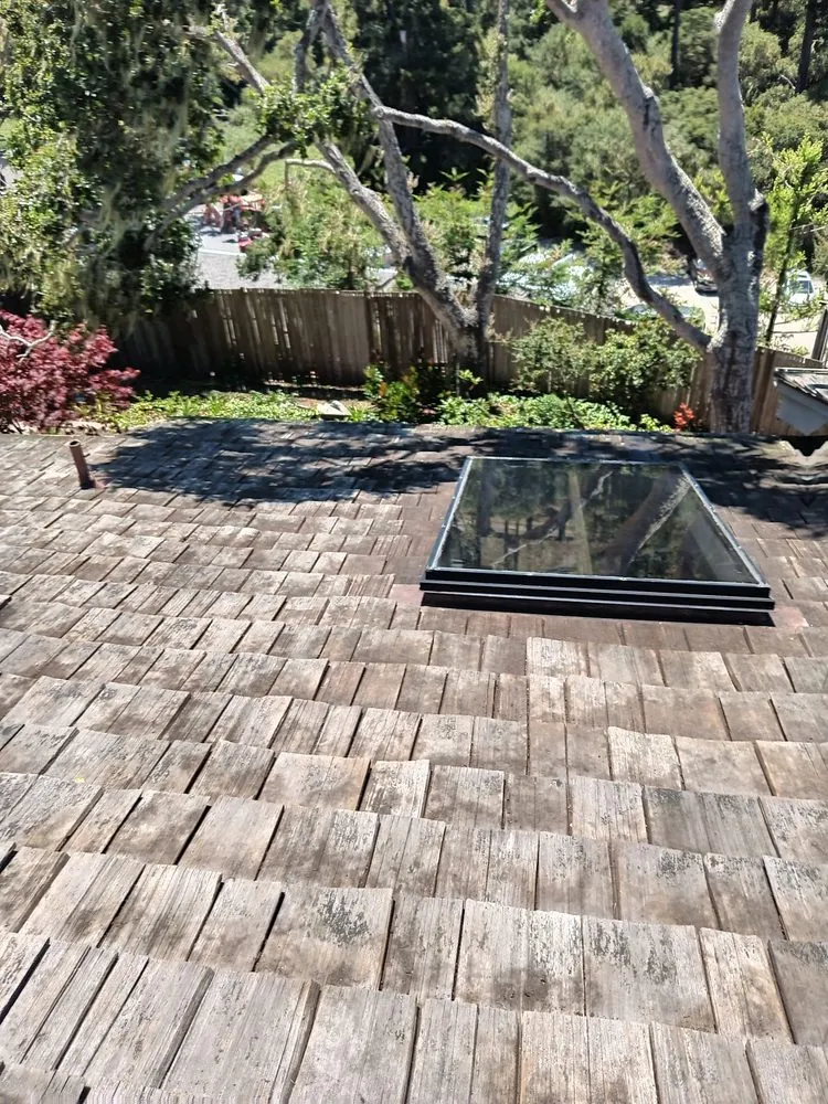 Slide of Rick's Roof & Gutter Cleaning Service