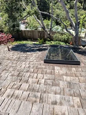 Rick's Roof & Gutter Cleaning Service Logo