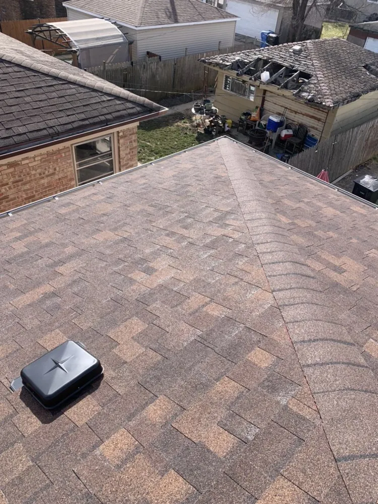 Slide of Rico’s Roofing & Siding