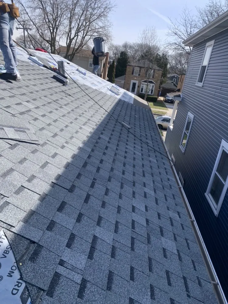 Slide of Rico’s Roofing & Siding