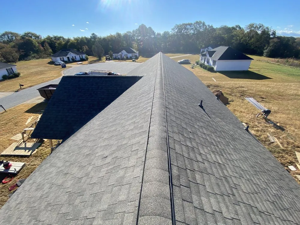 Slide of Rico’s Roofing Restorations