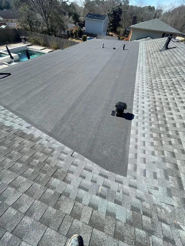 Slide of Rico’s Roofing Restorations